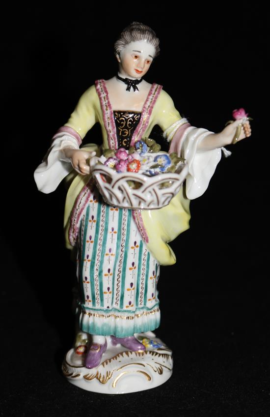 A Meissen figure of a lady picking flowers, 14cm